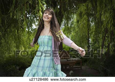 Woman in garden View Large Photo Image Stock Photograph - Woman in garden. Fotosearch