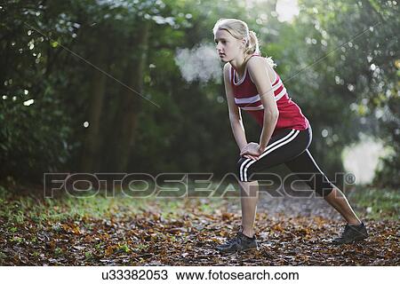 Woman stretching in woods View Large Photo Image Stock Image - Woman stretching in woods. Fotosearch
