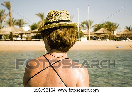 Woman sunning by seaside, Sharm El Sheikh, Egypt View Large Photo Image Picture - Woman sunning by seaside, Sharm El Sheikh, Egypt. Fotosearch