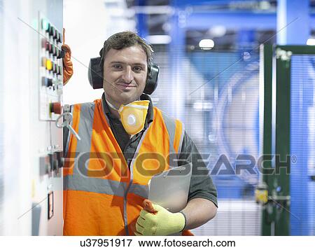 Worker at controls of metal ore grinding mill View Large Photo Image Stock Photo - Worker at controls of metal ore grinding mill. Fotosearch
