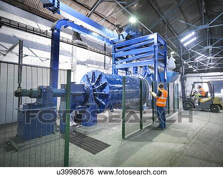 Workers in metal ore grinding mill View Large Photo Image Stock Photograph - Workers in metal ore grinding mill. Fotosearch