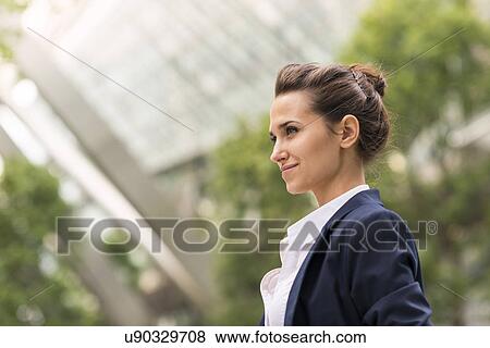 Stock Photo - Young businesswoman at Broadgate Tower, London, UK. Fotosearch