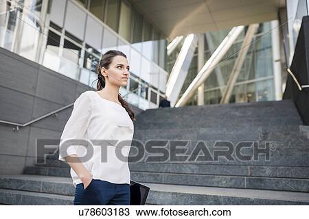 Young businesswoman carrying digital tablet, London, UK View Large Photo Image Stock Image - Young businesswoman carrying digital tablet, London, UK. Fotosearch