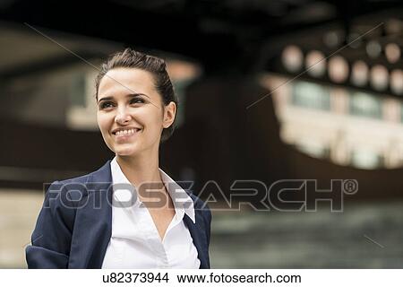 Young businesswoman outside station with digital tablet, London, UK View Large Photo Image Picture - Young businesswoman outside station with digital tablet, London, UK. Fotosearch