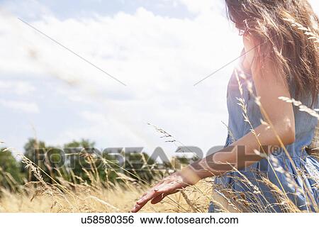 Stock Photograph - Young woman enjoying nature, Roznov, Czech Republic. Fotosearch