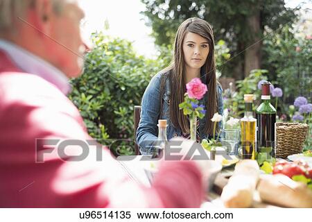 Young woman having lunch outdoors View Large Photo Image Stock Photography - Young woman having lunch outdoors. Fotosearch