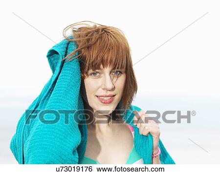 Young woman in bikini drying hair with towel View Large Photo Image Stock Photograph - Young woman in bikini drying hair with towel. Fotosearch