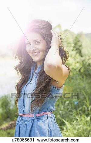 Young woman posing View Large Photo Image Stock Image - Young woman posing. Fotosearch
