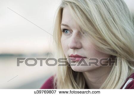 Young woman with blonde hair, portrait View Large Photo Image Stock Photo - Young woman with blonde hair, portrait. Fotosearch