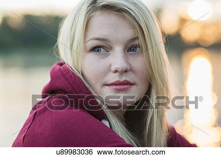 Young woman with blonde hair, portrait View Large Photo Image Stock Photograph - Young woman with blonde hair, portrait. Fotosearch