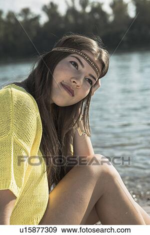 Young woman with brown hair wearing headband, portrait View Large Photo Image Stock Photo - Young woman with brown hair wearing headband, portrait. Fotosearch