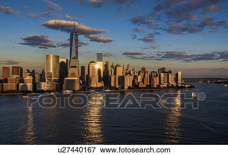 Stock Photo - Aerial view of city with Freedom tower at sunset. Fotosearch