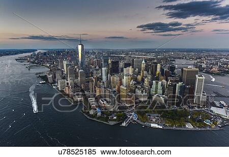Stock Photography - Aerial view of city with Freedom tower at sunset. Fotosearch