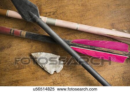 Arrows and arrowhead on table View Large Photo Image Stock Photography - Arrows and arrowhead on table. Fotosearch