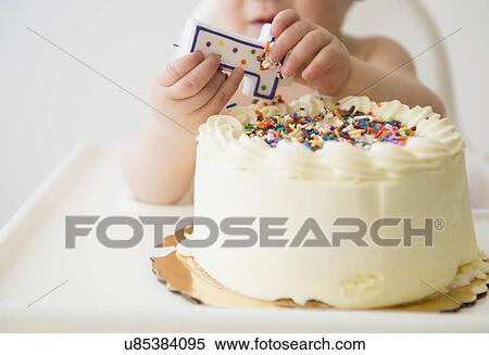 Baby girl (12-17 months) celebrating first birthday View Large Photo Image Stock Photography - Baby girl (12-17 months) celebrating first birthday. Fotosearch