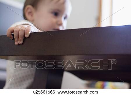 Baby girl (12-17 months) standing up View Large Photo Image Stock Photograph - Baby girl (12-17 months) standing up. Fotosearch