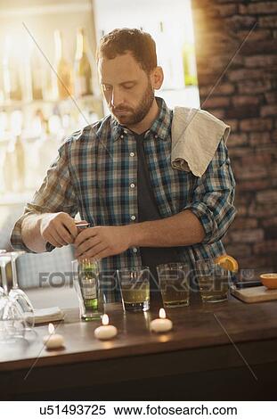 Bartender opening bottle View Large Photo Image Stock Photography - Bartender opening bottle. Fotosearch