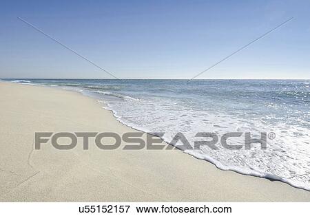 Stock Photo - Beach with blue sky. Fotosearch