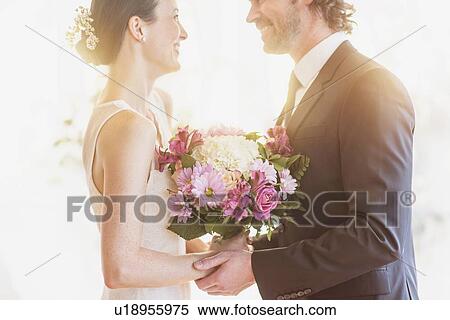 Bride and groom celebrating their wedding View Large Photo Image Stock Photography - Bride and groom celebrating their wedding. Fotosearch