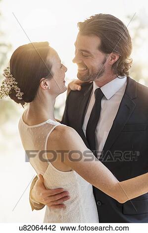 Stock Image - Bride and groom dancing. Fotosearch