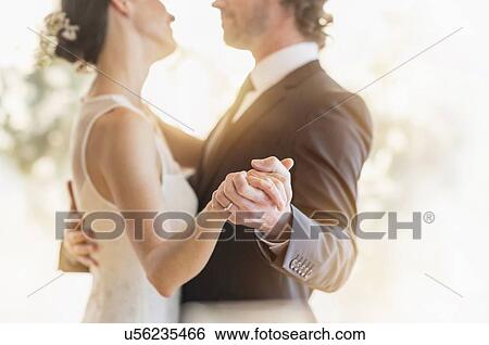 Stock Photograph - Bride and groom dancing. Fotosearch