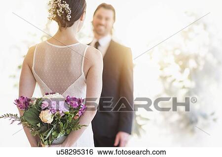 Bride and groom looking at each other View Large Photo Image Stock Photograph - Bride and groom looking at each other . Fotosearch
