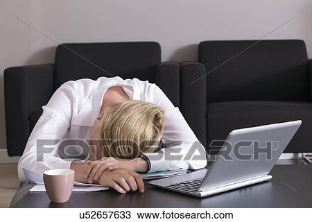 Business Woman Sleeping On Desk Near Computer Stock Image