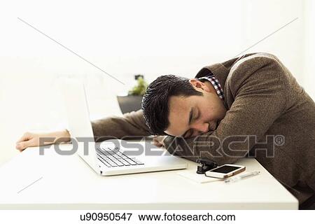 Stock Photo - Businessman sleeping in office. Fotosearch
