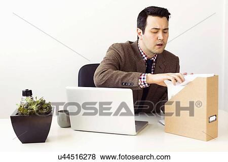 Businessman working in office View Large Photo Image Stock Photo - Businessman working in office. Fotosearch
