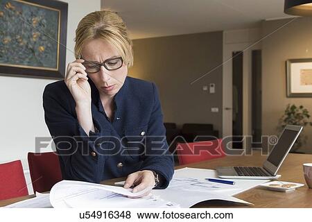 Businesswoman working art home View Large Photo Image Stock Photo - Businesswoman working art home. Fotosearch