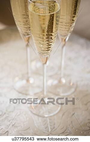 Stock Image - Champagne on table. Fotosearch