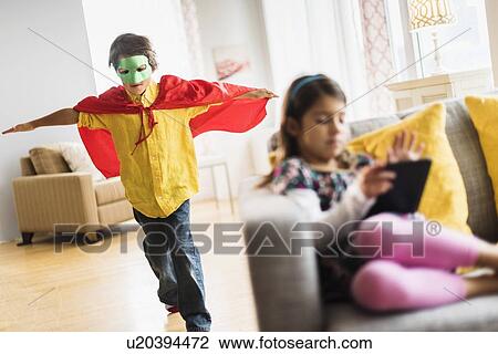 Stock Image - Children (6-7) playing at home. Fotosearch