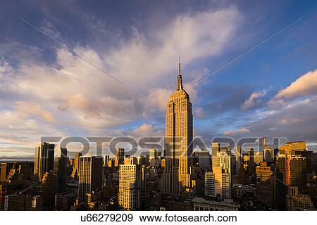Stock Photo - Cityscape with Empire State Building at sunset. Fotosearch