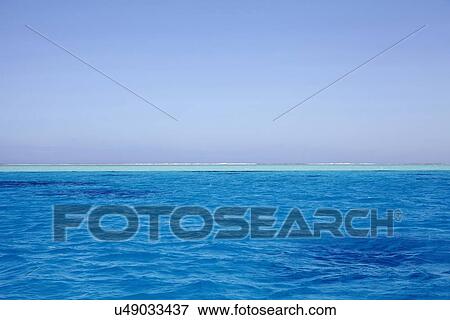 Clear sky above blue rippled sea View Large Photo Image Stock Photo - Clear sky above blue rippled sea. Fotosearch