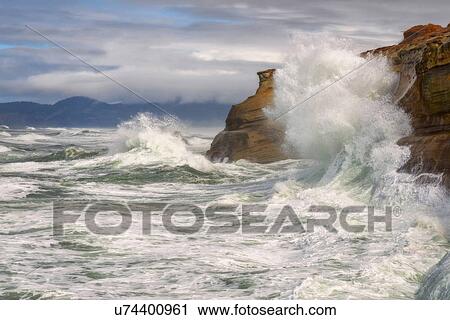 Stock Image - Cliffs and cloudy sky during storm . Fotosearch