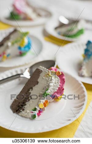Stock Photo - Close-up of birthday cake slice. Fotosearch