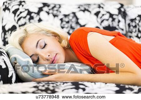 Stock Photo - close-up of woman sleeping on sofa. Fotosearch
