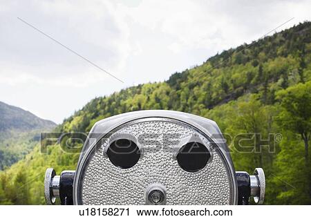 Close-up view of coin-operated binoculars against background of wooded Adirondack Mountains View Large Photo Image Stock Image - Close-up view of coin-operated binoculars against background of wooded Adirondack Mountains. Fotosearch