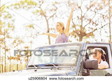 Couple in car View Large Photo Image Picture - Couple in car. Fotosearch
