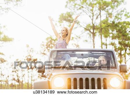 Couple in car View Large Photo Image Stock Photo - Couple in car. Fotosearch