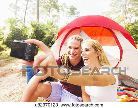 Stock Image - Couple taking selfie. Fotosearch