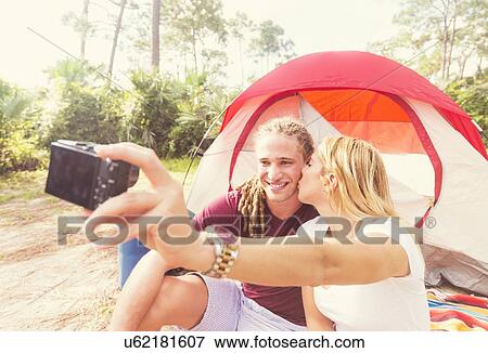 Stock Photo - Couple taking selfie. Fotosearch