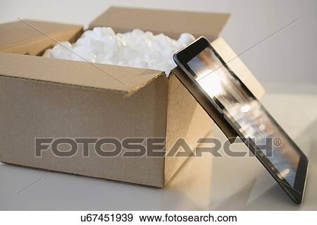 Stock Photo - Digital tablet and box. Fotosearch