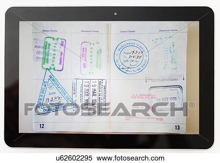 Digital tablet and passport View Large Photo Image Stock Photography - Digital tablet and passport. Fotosearch