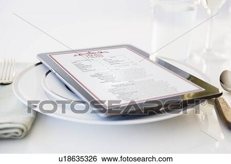 Digital tablet on plate View Large Photo Image Stock Photograph - Digital tablet on plate. Fotosearch