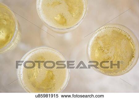 Directly above view of champagne flutes View Large Photo Image Stock Photography - Directly above view of champagne flutes. Fotosearch