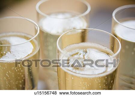 Elevated view of champagne flutes View Large Photo Image Stock Photo - Elevated view of champagne flutes. Fotosearch