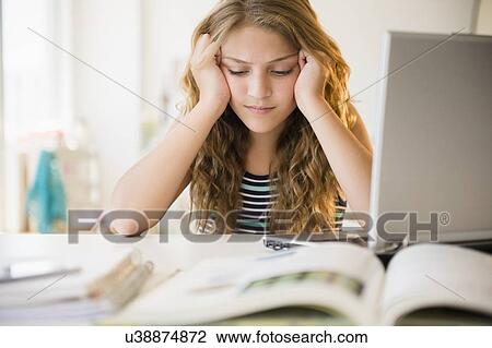 Girl (12-13) doing homework View Large Photo Image Stock Image - Girl (12-13) doing homework. Fotosearch