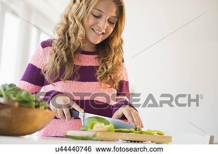 Girl (12-13) preparing salad View Large Photo Image Stock Photograph - Girl (12-13) preparing salad. Fotosearch