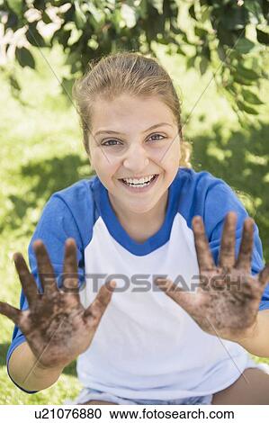 Girl (12-13) with dirty hands View Large Photo Image Stock Image - Girl (12-13) with dirty hands. Fotosearch